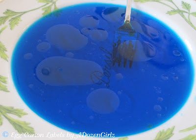 Salad Dressing Easter Eggs: Simple, Marbled Beauty Swirl food gel through the water, vinegar, oil mixture with a fork without dissolving it completely.